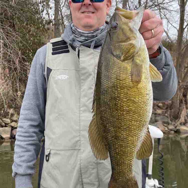 Image of Robbie T with a monster 4 lbs bass caught using a TSA Firecraw Flatside lure