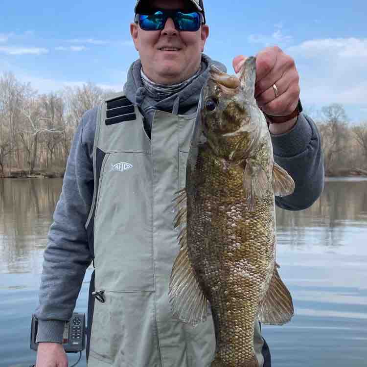 Image of Robbie T with a monster 4 lbs bass caught using a Firecraw Flatside TSA lure